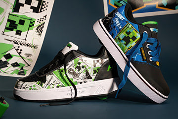 Heelys x Minecraft roller shoes. Pair of black and green Heelys with a Minecraft design on a dark background.